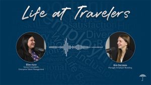 Life at Travelers podcast promotional image featuring Ellen Vyce, Senior Consultant, Enterprise Talent Management, and Kim DeLissio, Manager, Employer Branding. Two women in circular profile photos are positioned on either side of a white audio waveform graphic. The background is dark blue with faded workplace-related words including Satisfaction, Career, Diversity, and Perspective. Travelers umbrella logo appears in the bottom right corner.