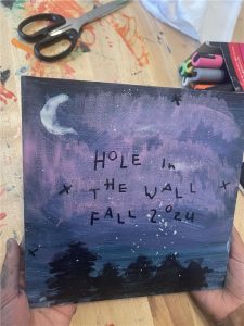 Painting of a night sky with bird and tree silhouettes that says Hole in the Wall Fall 2024
