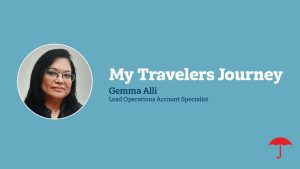 Professional header slide with light blue background featuring a circular headshot of Gemma Alli, a woman with dark hair wearing glasses, alongside white text reading 'My Travelers Journey' and 'Gemma Alli, Lead Operations Account Specialist.' The Travelers red umbrella logo appears in the bottom right corner.
