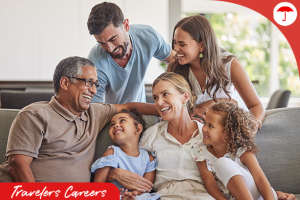 Multi-generational family smiling together on a couch.