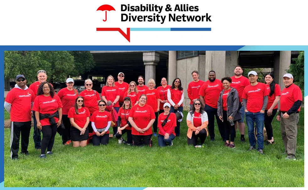 Disability & Allies Diversity Network. Group of employees in red Travelers shirts posing outdoors.